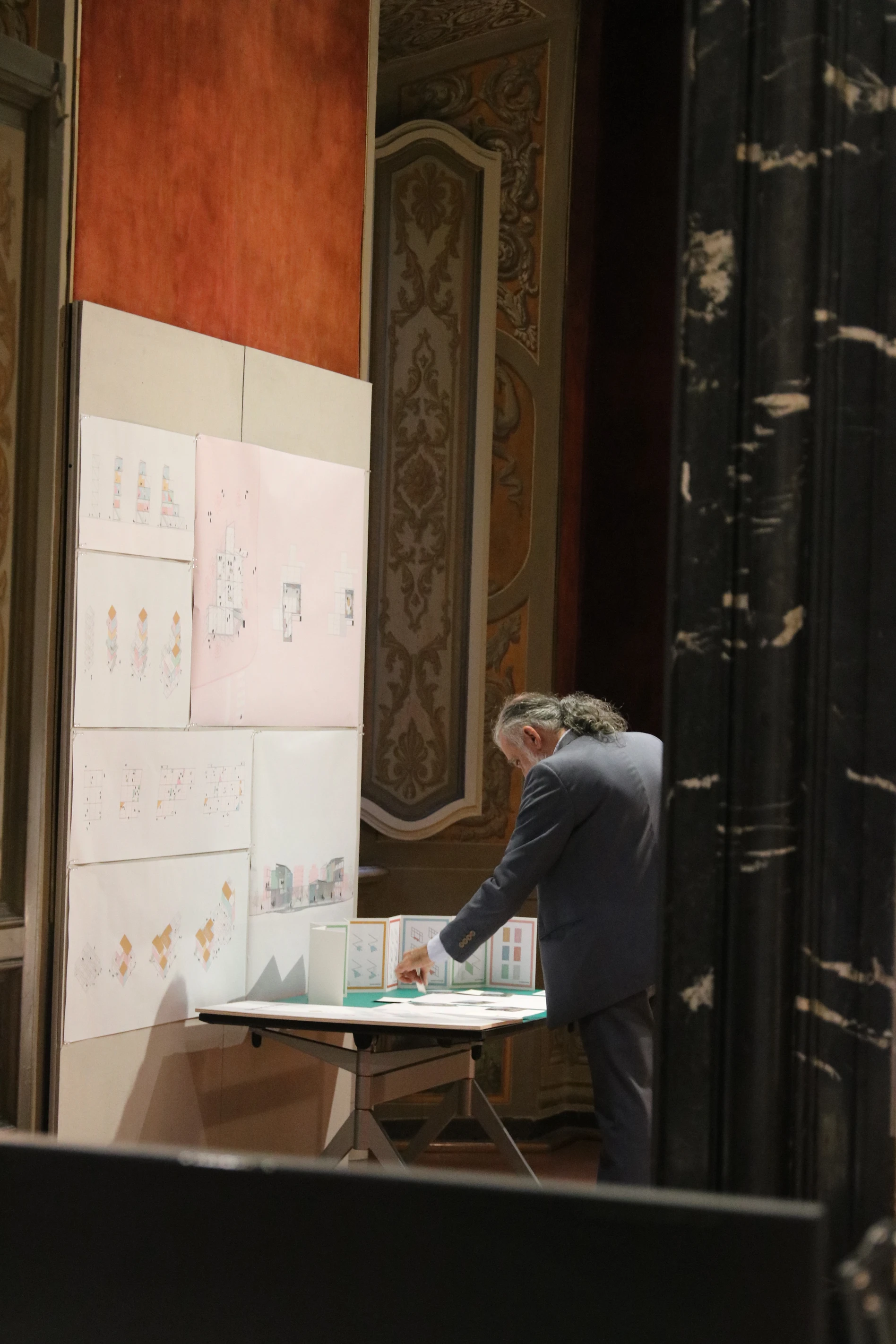 An elderly man looking at our project pamphlets.