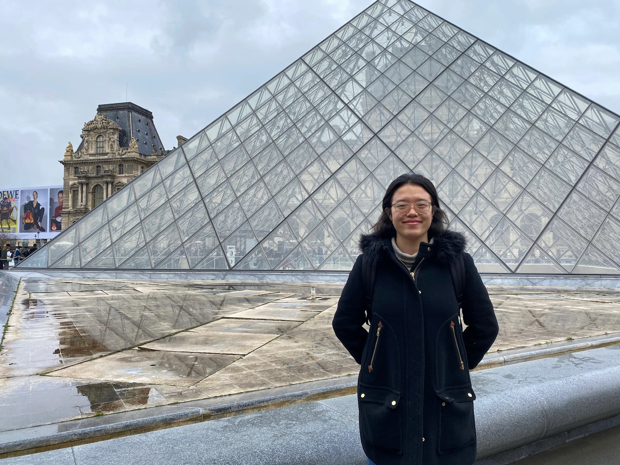 Desai in front of the louvre.