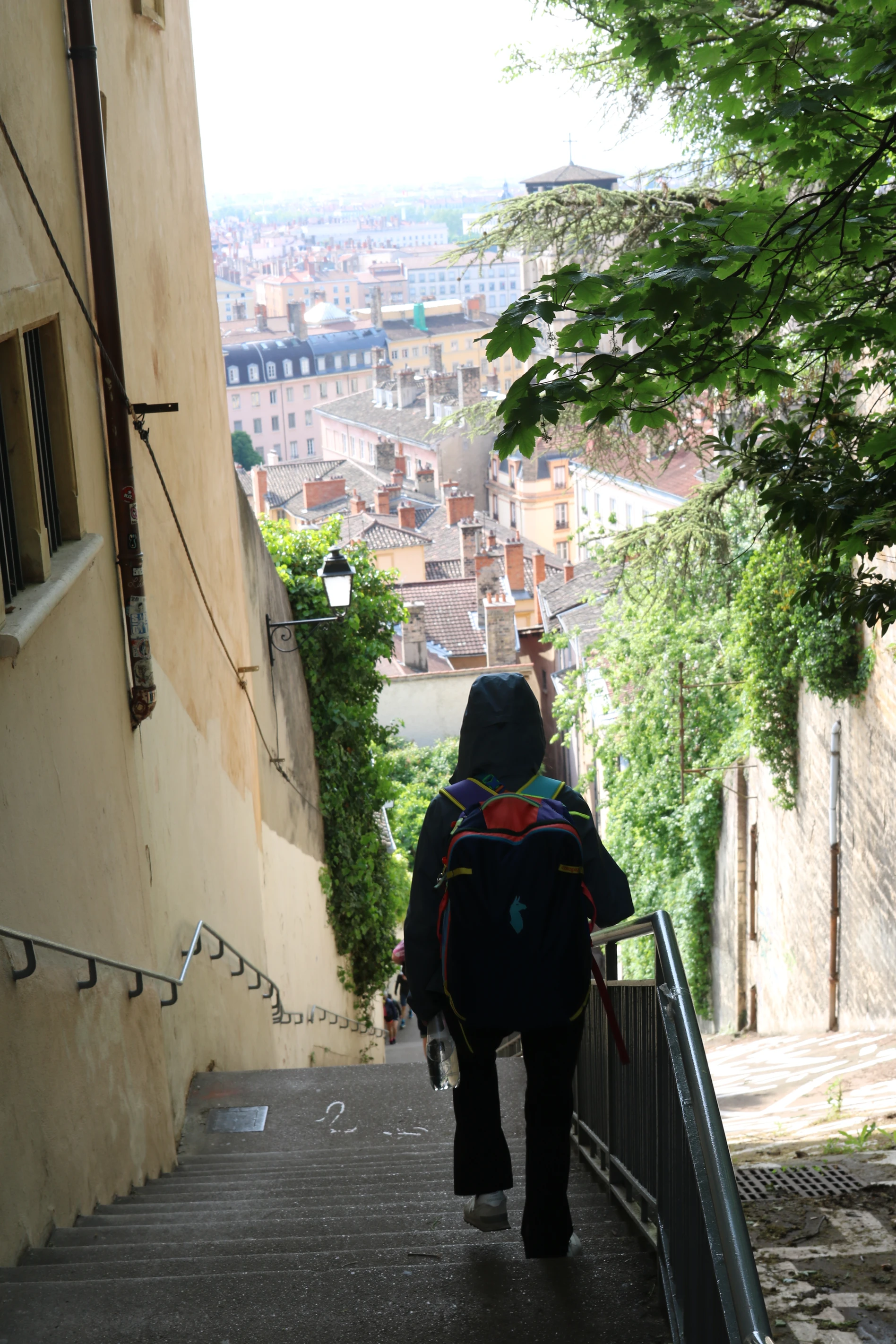 Walking narrow stairs down to Lyon's town center.