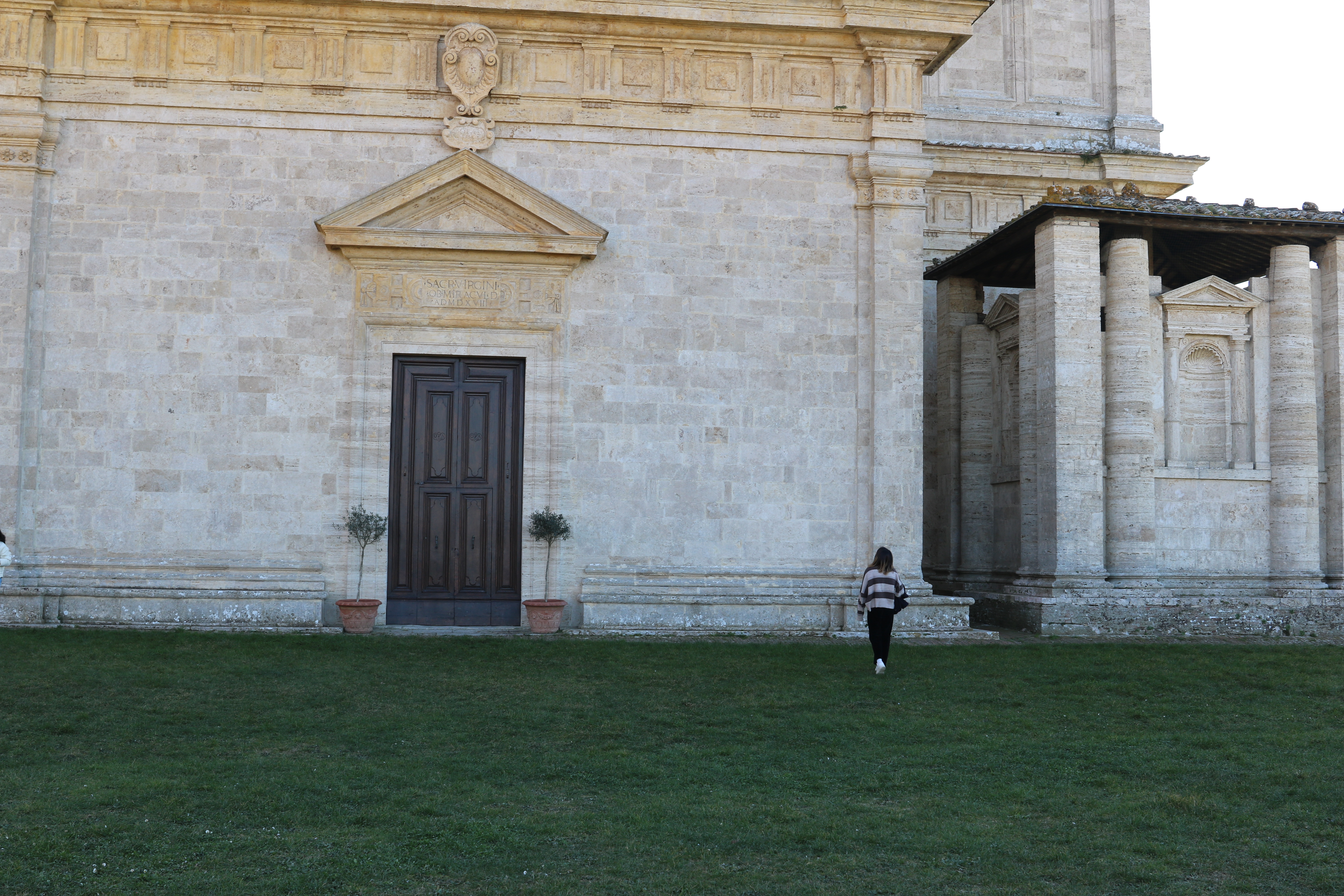 Elevation view of the church, with a human figure for scale.