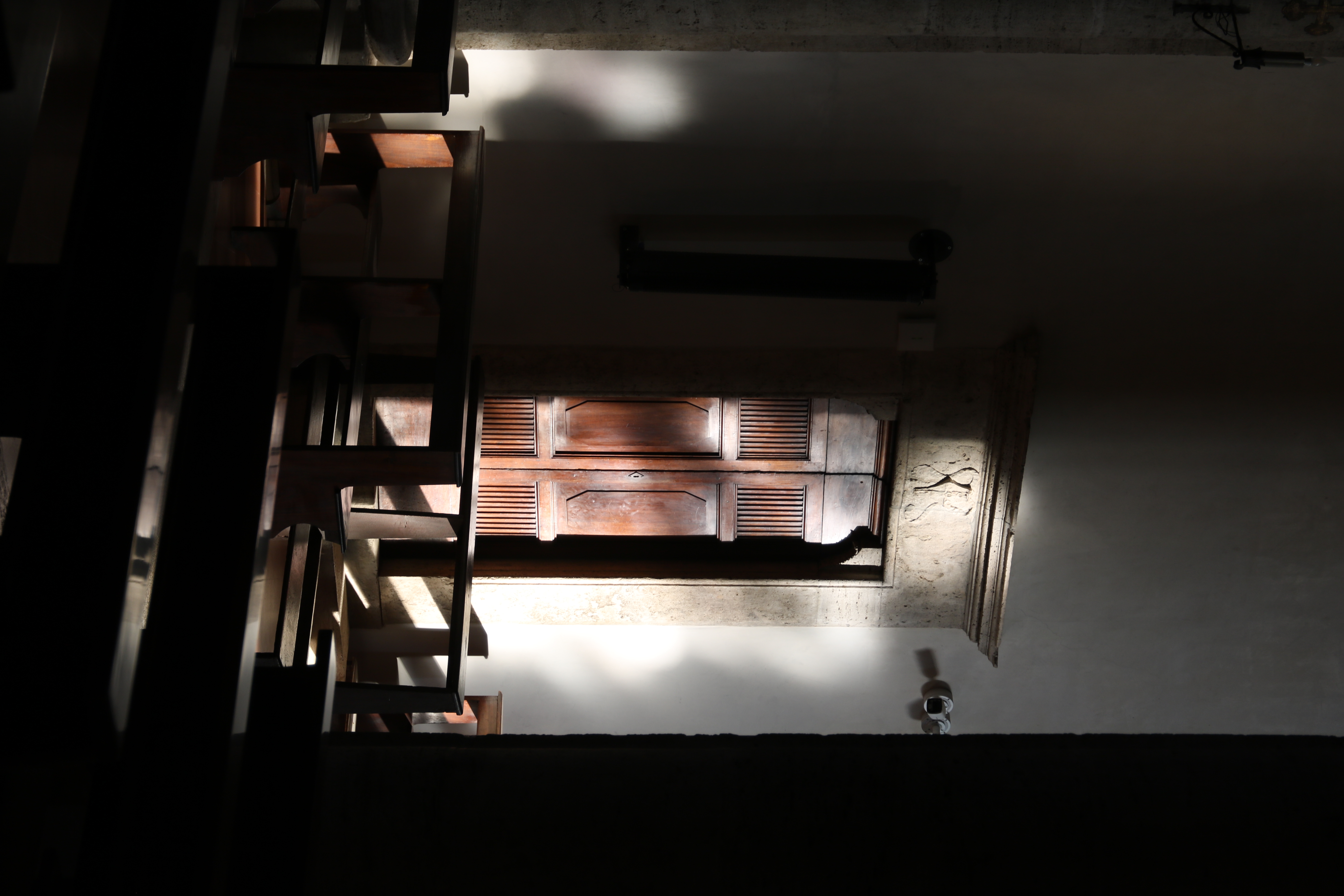 Light streaming in from the windows into a church.