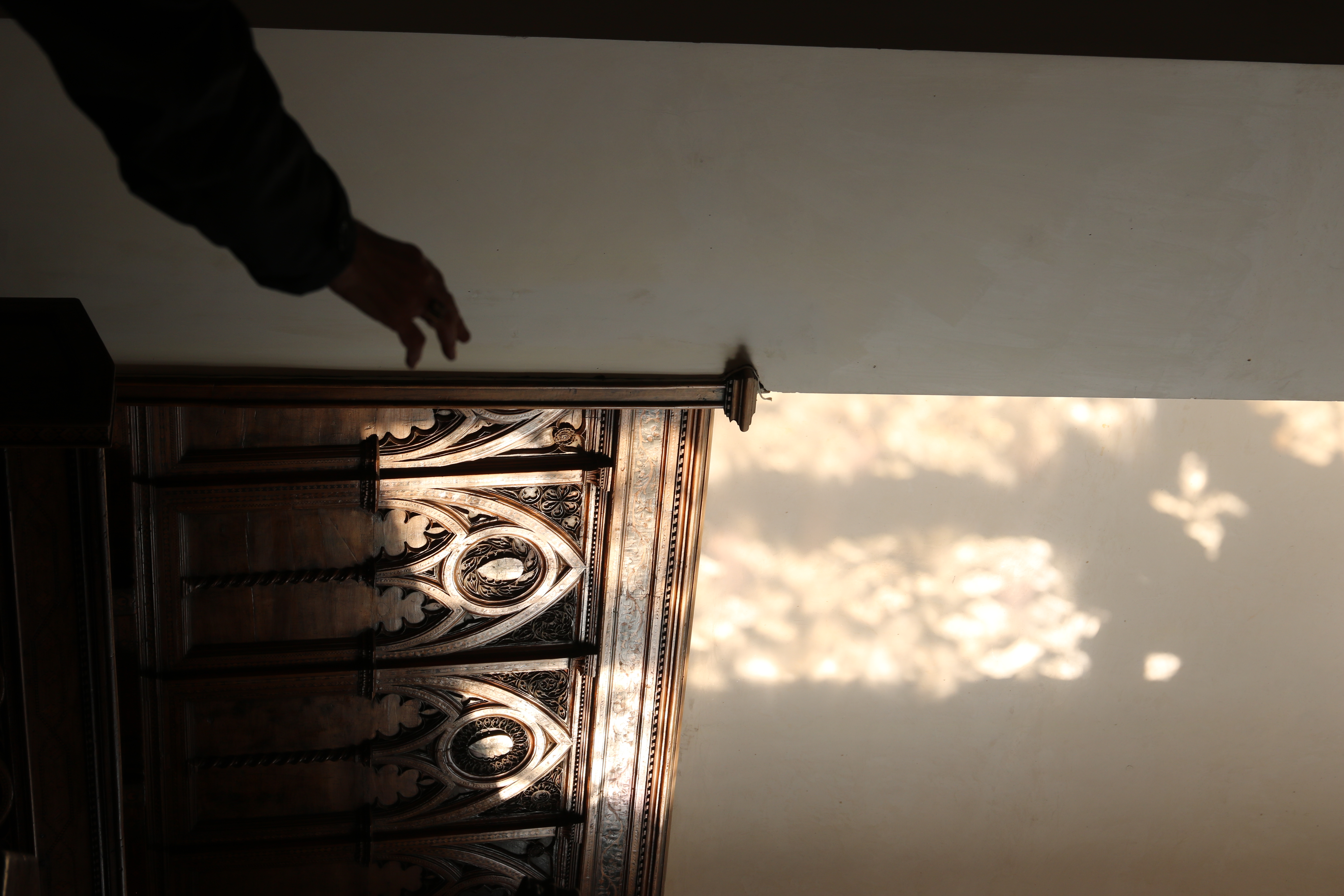 A hand reaching out as the light streams in.